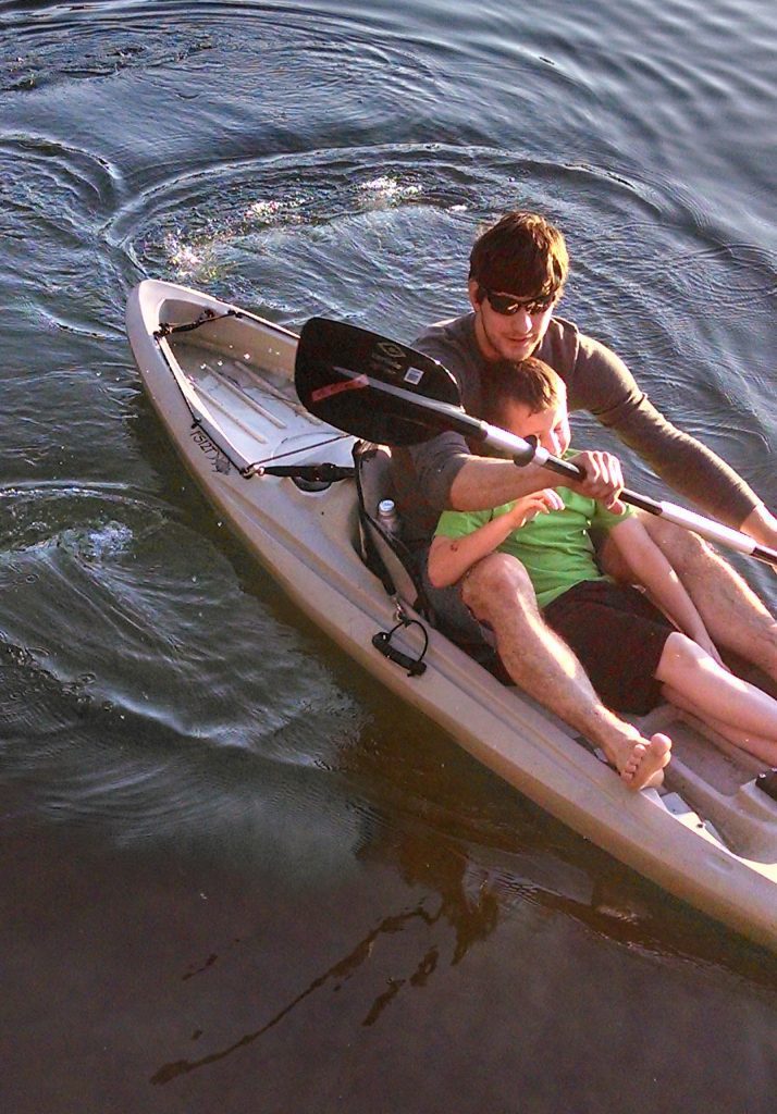 Father and son kayaking.