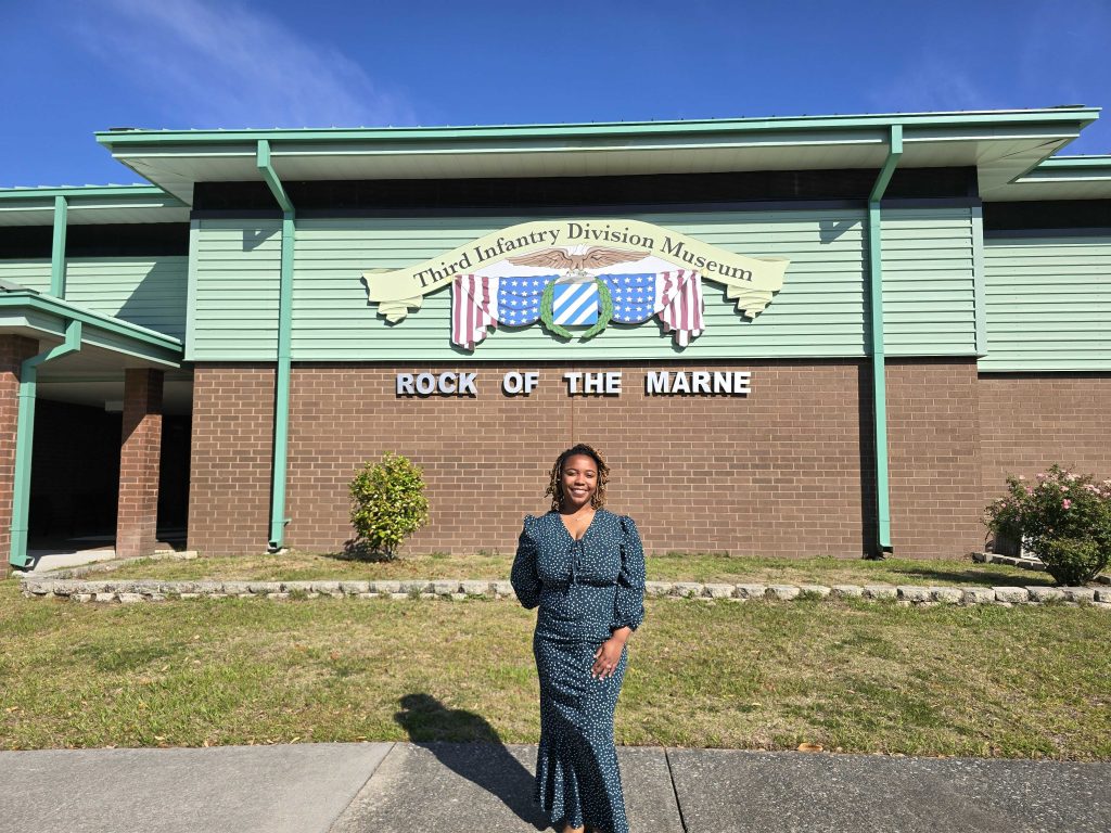 women standing in front of building