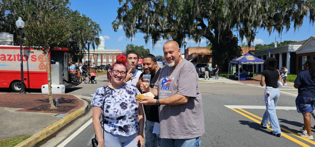 A family smiling at Food Truck Festival