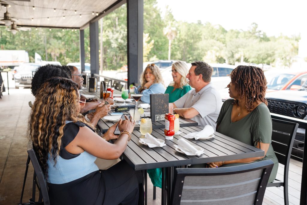Group enjoying outdoor seating at World of Beer
