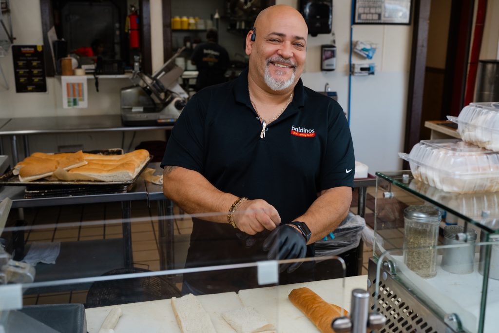 baldinos manager behind the counter